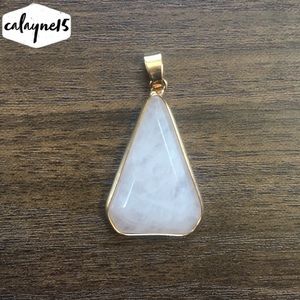 Rose quarts stone in gold triangle case